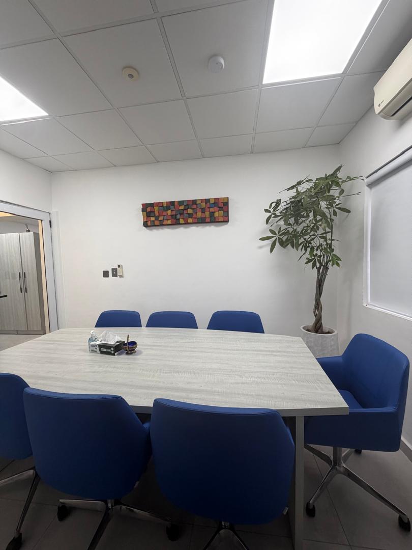 Suite 1A meeting room showing conference seating and air-conditioned interior